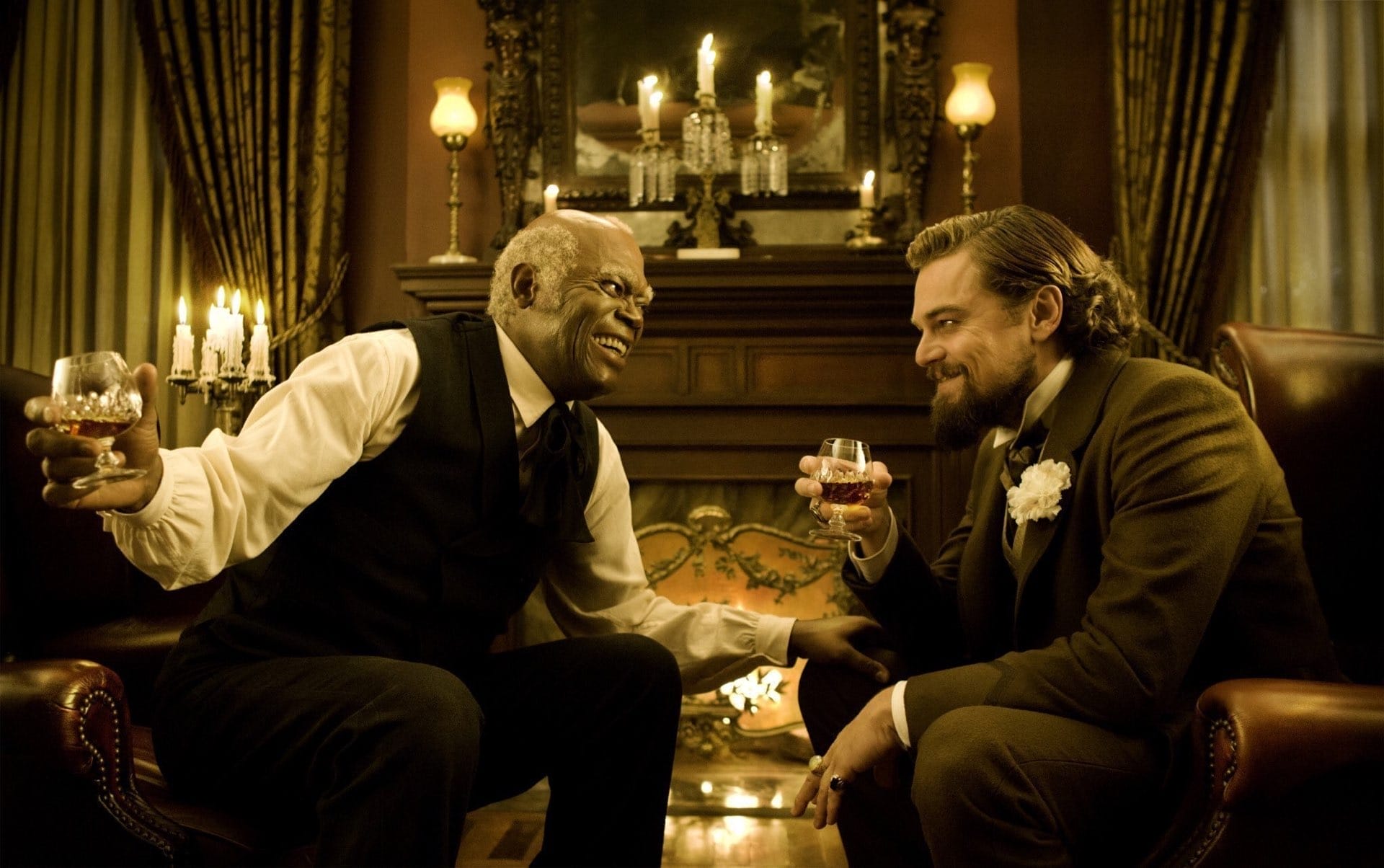 Stephen and Calvin Candie sharing drinks in Django Unchained, illustrating false loyalty — the offshore manager archetype who survives by pleasing those above while suppressing those below.